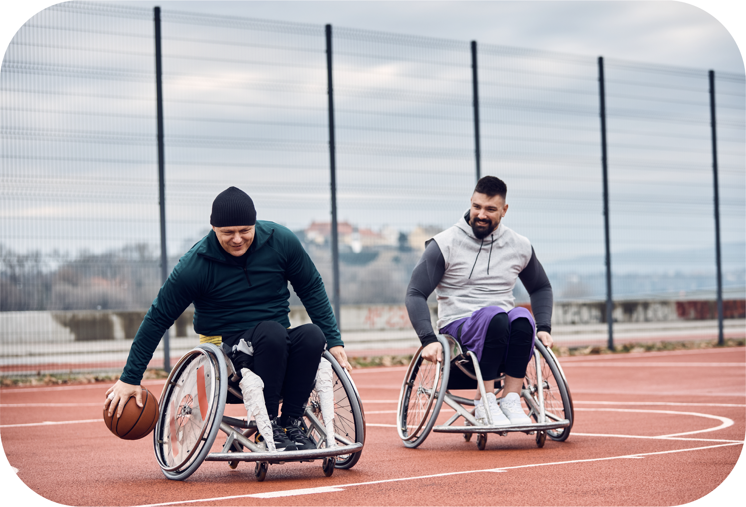 two people playing wheelchair basketball